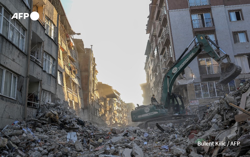 excavator clears debris in Hatay, Turkey